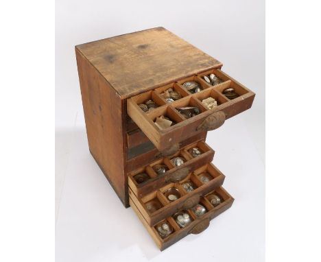 Small chest of eight drawers containing wrist and pocket watch glasses (qty)