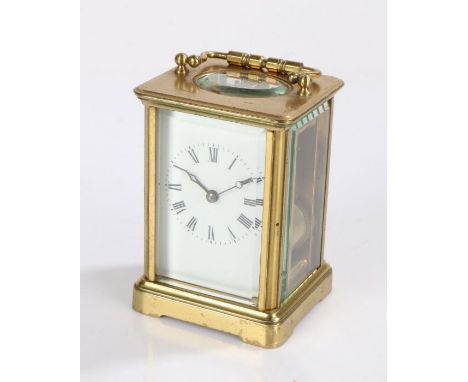 20th Century brass cased carriage clock, having visible platform escapement, white enamel dial with black Roman numerals, 10.