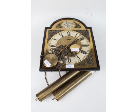 Brass Wall clock made by Hermle with Roman numerals, mask and acanthus leaf spandrels