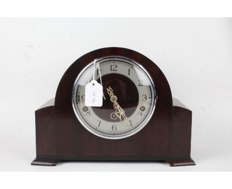 Enfield Clock Co mantel clock, with domed mahogany case, the silvered dial with Arabic numerals, strike/silent switch, Westmi