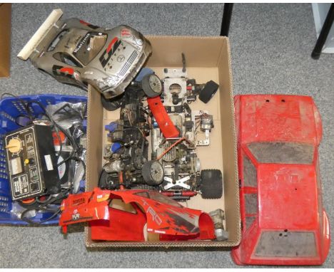 Two petrol driven 2 stroke 1:5 scale remote control cars with three car shells and a Magnum model engine starter. 