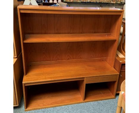 A G-plan teak wall unit, the open shelf top over single drawer and open base. 