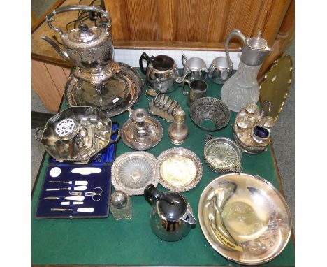 A box of miscellaneous plated ware, including a spirit kettle, chamber sticks, cased and loose cutlery, tea service, cased ma