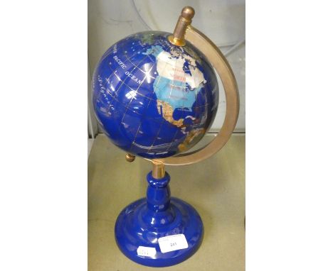 A brass mounted globe on blue ceramic base 33cm tall 