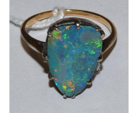 A gold mounted black opal doublet ring, 16 x 10 mm, size N