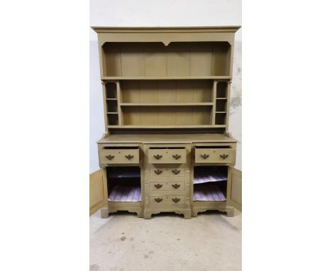 A&nbsp;pale green painted pine dresser, the three shelf rack over three frieze drawers, over three dummy drawers flanked by c