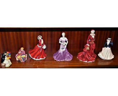 Ceramic figurines by Royal Doulton, Royal Worcester and Coalport, including two miniature "street vendors", "mistletoe and wi
