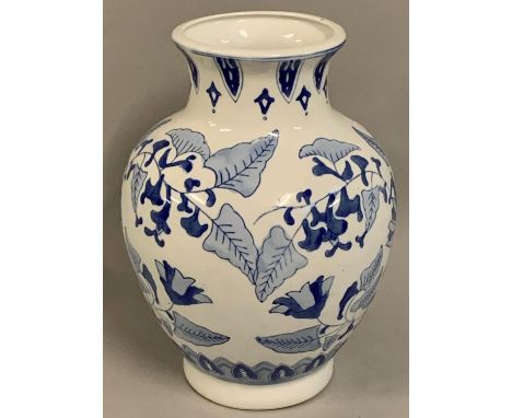 A Chinese blue and white baluster vase, decorated with floral sprays, blue character seal mark, 31 cm.