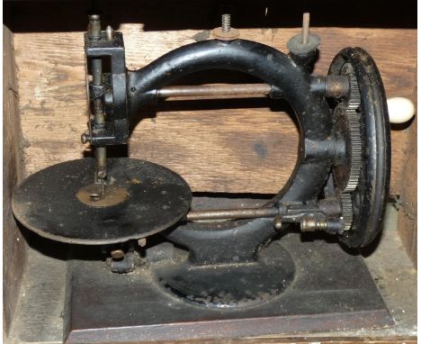 A Wanzer manual sewing machine, circa 1880, decorated with black lacquer, Time Utilizer Trade Mark, No 38581, 32 x 14 x 24cm,