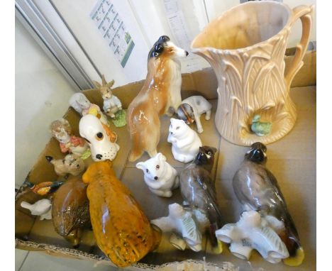 A tray of animal figures including a pair of Goebel birds, Goebel bear, Beswick terrier, Royal Albert Peter Rabbit, Bewsick T