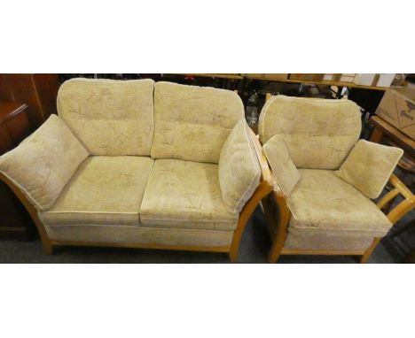 A light oak framed two piece suite comprising of a two seater sofa 145cm wide and an armchair (2) 