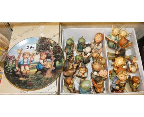 A boxed set of Hummel Christmas ornaments, together with a collection of Hummel and Goebel figurines. 