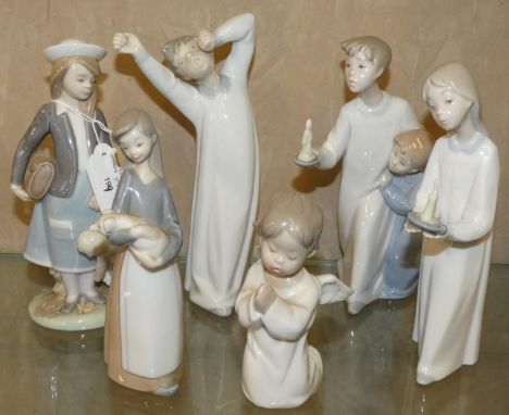 A collection of six Lladro ceramic figurines 