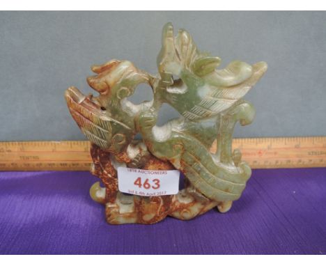 A jade figure modelled as Oriental dragon and phoenix