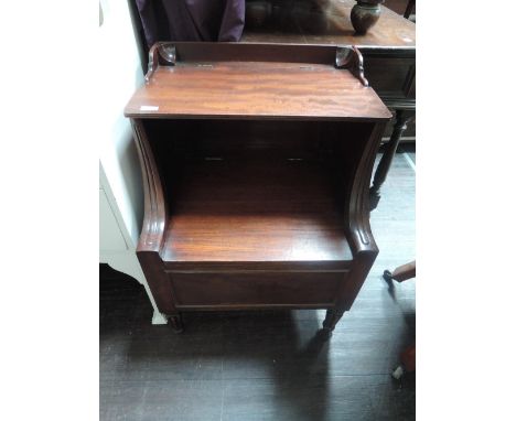 An early Victorian mahogany step commode having lift top, base and reeded legs
