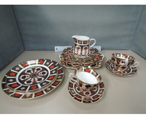 A Royal Crown Derby part tea and dinner service in the Imari palette