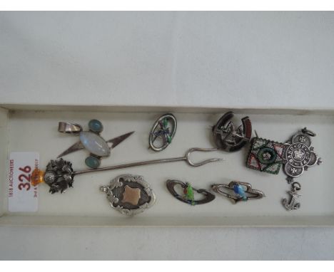 A small selection of HM silver and white metal including mosaic brooch, thistle pickle fork, pendants and medalions, enamelle