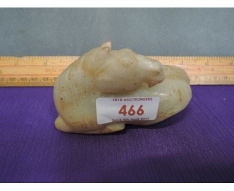 A jade/hardstone figure modelled as a lying horse