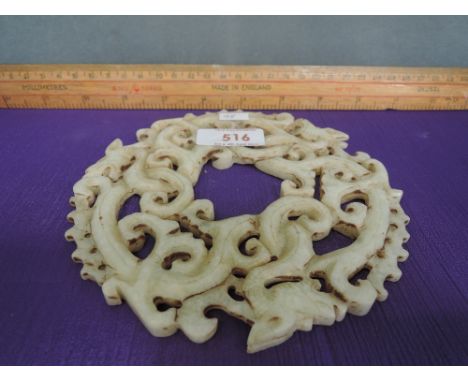 A jade Hetian Bi of dragon swirl form