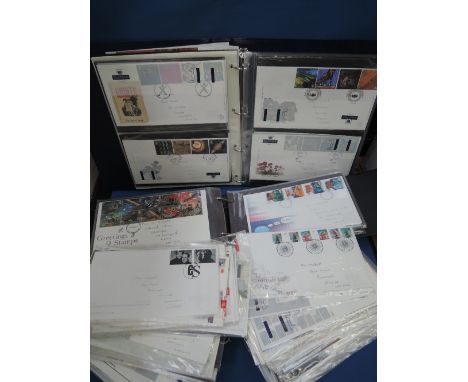 A collection of GB First Day covers in two albums and loose, loose covers 2000-2012 pencil address, high face value