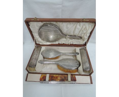 A cased silver dressing table set having engine turned decoration and initialled G,  Birmingham 1911,  Synyer & Beddoes