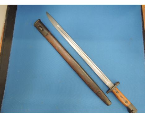 A World War 1 bayonet with scabbard by Wilkinson, 4LNL113 on handle, good condition