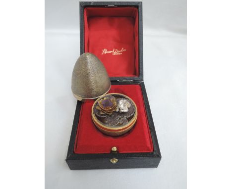 A Stuart Devlin silver gilt surprise egg for year 1973, Limited edition no 170, containing a silver frog and gem stone lily o