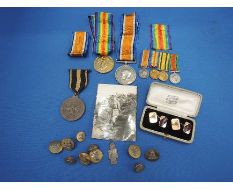 Two World War I medals to Capt L M Wooland, four miniature medals, St Johns Railway Medal, Royal Artillery buttons and pair o