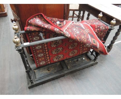 A 19th century cast iron stick stand, having brass finials of five division top