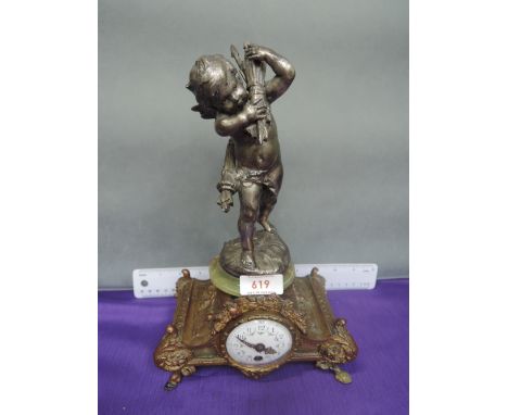 A late 19th/early 20th century French mantel clock of brass ormolu style having cast spelter cherub and onyx mount by Moreau