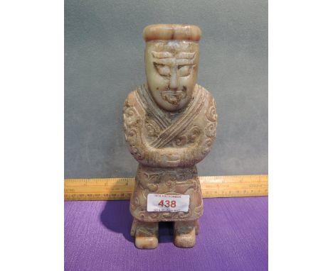 A jade figure modelled as carved courtier