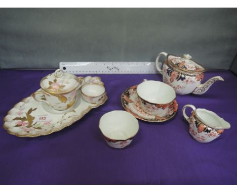 A Royal Crown Derby tea for one service in gilt heightened Imari palette, various year marks and a 19th century Bisto gilt he