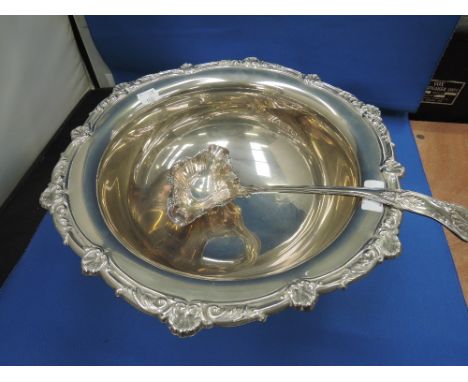 A silver plated punch bowl having a repousse shell and scroll rim and pedestal foot with pouring ladle in the Kings Pattern