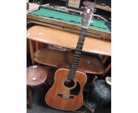 A Tanglewood TW-40 acoustic guitar