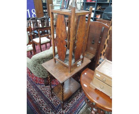 An early/mid 20th century oak stick stand and a similar period twist leg occasional table