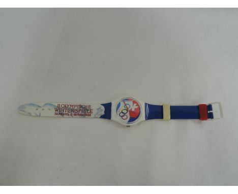 A cased Swatch souvenir wrist watch for the 1996 Atlanta Winter Olympic Games, in unused condition