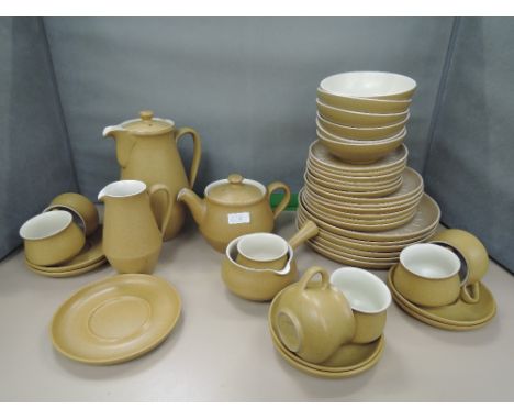 A Denby stoneware tea, coffee, dinner service in mustard buff ground