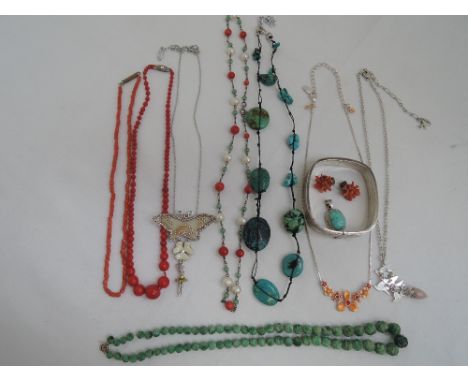 A small selection of costume jewellery including a cultured pearl and jade necklace, coral beads, carved jade beads, turquois