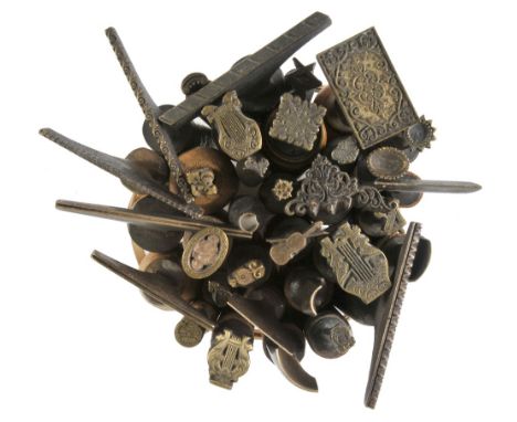 *Decorative finishing tools. Twenty brass decorative finishing tools, mostly comprising centre tools with traditional designs