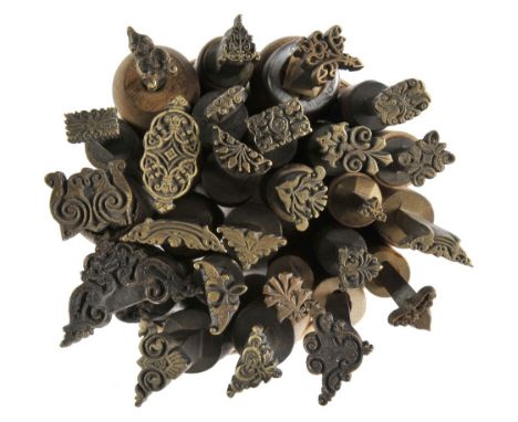 *Decorative finishing tools. Twenty-five brass decorative finishing tools, comprising centre tools & corner tools of traditio