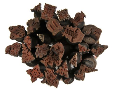 *Decorative finishing tools. Seventy decorative finishing tools, comprising centre & corner tools, including 10 paired corner