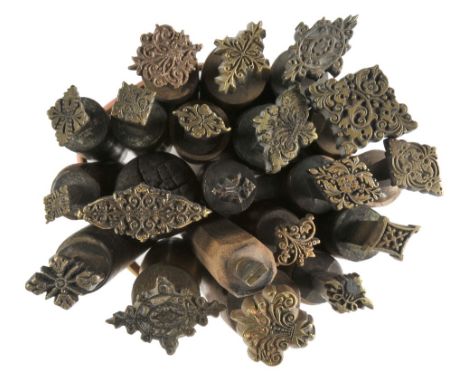 *Decorative finishing tools. Twenty brass decorative finishing tools, comprising centre tools of traditional design, together