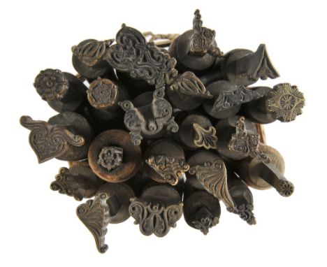 *Decorative finishing tools. Twenty-two brass decorative finishing tools, comprising centre & corner tools of traditional des