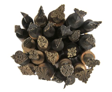 *Decorative finishing tools. Twenty-five brass decorative finishing tools, comprising centre & corner tools of traditional de