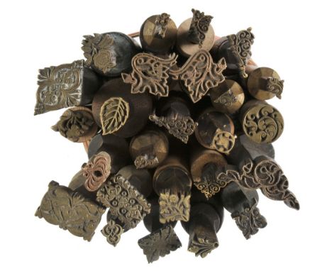 *Decorative finishing tools. Twenty-five brass decorative finishing tools, comprising centre tools & corner tools mostly of t