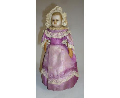 A wax shoulder head automaton doll with fixed blue glass eyes, inset blonde mohair wig, stuffed kid arms, stiff card body wit