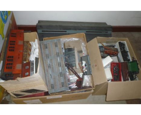 A quantity of O gauge wagon parts, wheels and other spare parts, various models, plastic and card lineside buildings for OO a