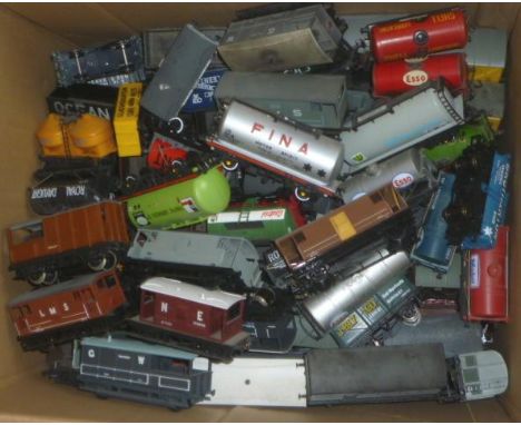 Approximately one hundred and eighty goods trucks by Airfix, Hornby and Bachmann including P.O. coal trucks, oil tankers, goo