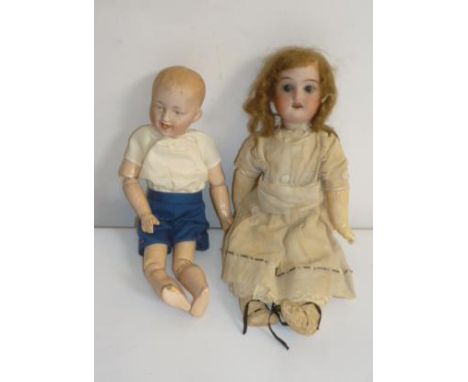A Gebruder Heubach bisque head character boy doll with intaglio eyes, moulded hair, joined composition limbs and body, and a 