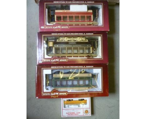 Three Bachmann "Big Hauliers", G scale coaches, boxed, G-E, and a Bachmann HO scale Streamline PCC trolley, boxed, E-M (Est. 